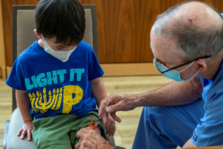 A three year old receives his Covid-19 vaccination in Needham, Massachusetts