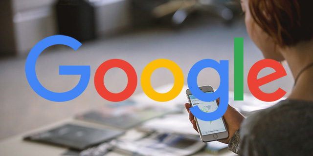 Woman looking at phone with Google logo