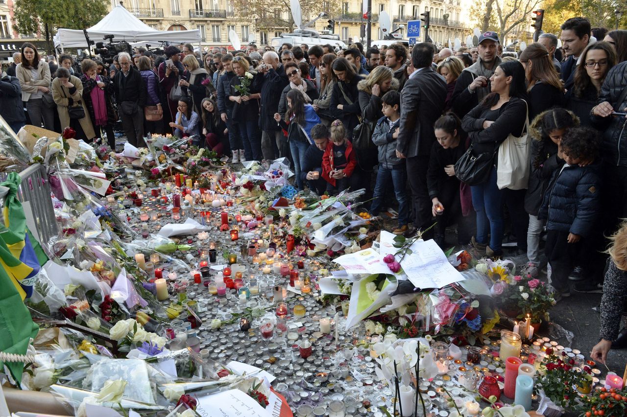 People gather at a makeshift memorial near the Bataclan concert hall in Paris on Nov. 15, 2015, two days after a series of deadly attacks by Islamic State militants where American citizens including Nohemi Gonzalez were killed. Gonzalez's family is suing Google for aiding ISIS by distributing its videos over YouTube.