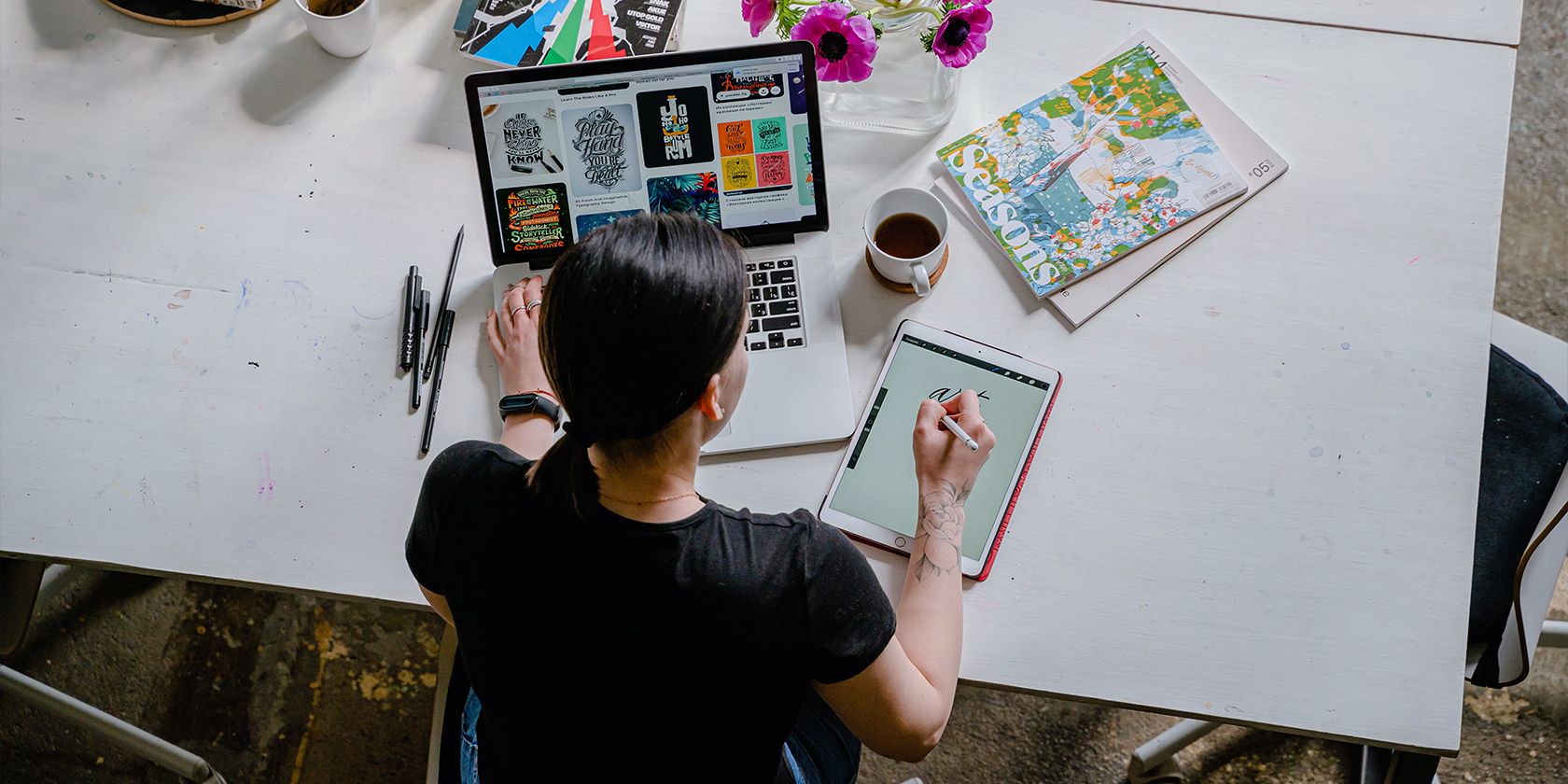 Graphic designer working on a white desk