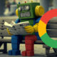 Google Robot Reading Newspaper On Bench