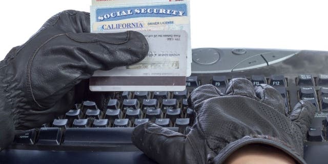 Scammer holds social security card
