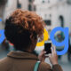 Woman Messaging On Street Google Logo