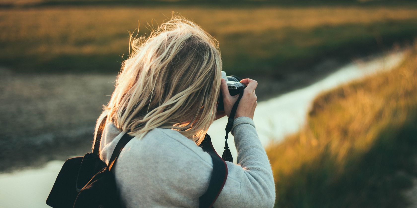 Photo of a person taking pictures outdoors