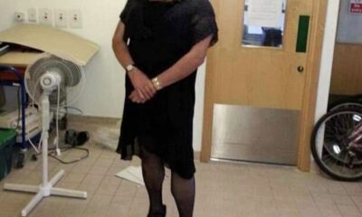In the 2013 image, Jim Hobson, 53, seems to be wearing make-up to darken his face, a black wig, black dress, tights and stiletto shoes
