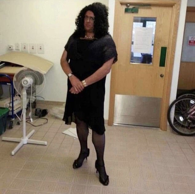 In the 2013 image, Jim Hobson, 53, seems to be wearing make-up to darken his face, a black wig, black dress, tights and stiletto shoes