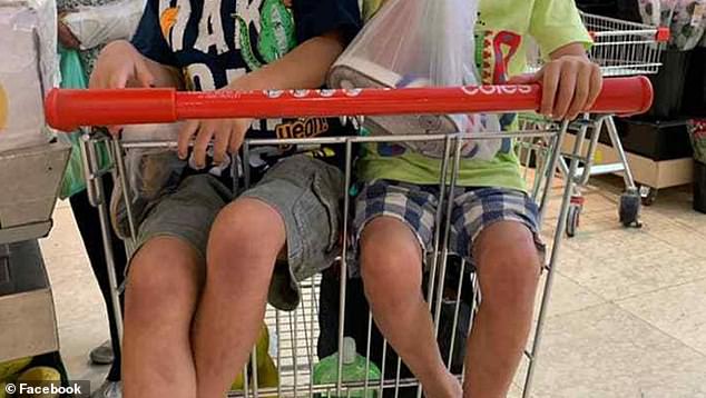 The mum posted a picture to a Facebook group for Sydney mothers showing her two children sitting in the Coles trolley, with their legs dangling through the bars