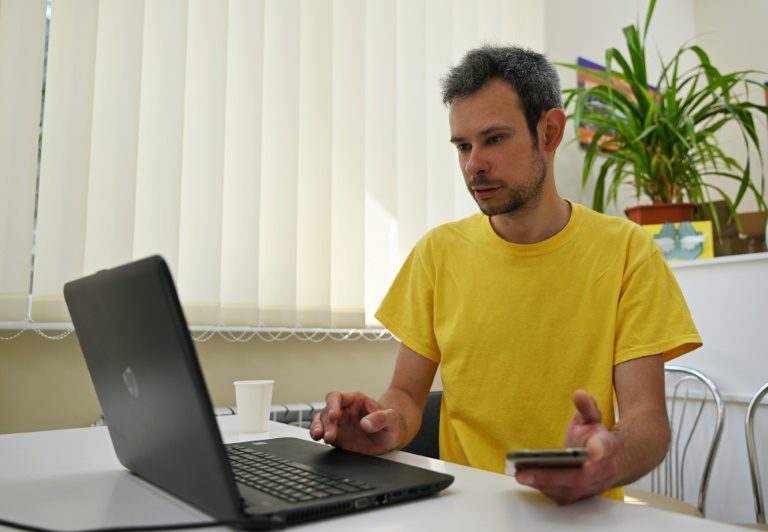 Bogdan Novak, a journalist at Pro100 media, speaks with AFP in Kramatorsk