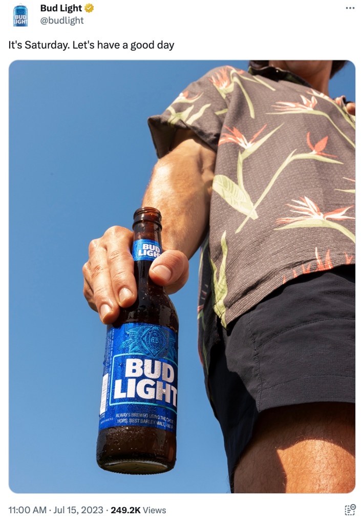 The tweet that was posted on Saturday features an image of a man holding an open bottle of Bud Light.