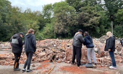 Mourners gather at rubble of Crooked House to lament pub’s destruction