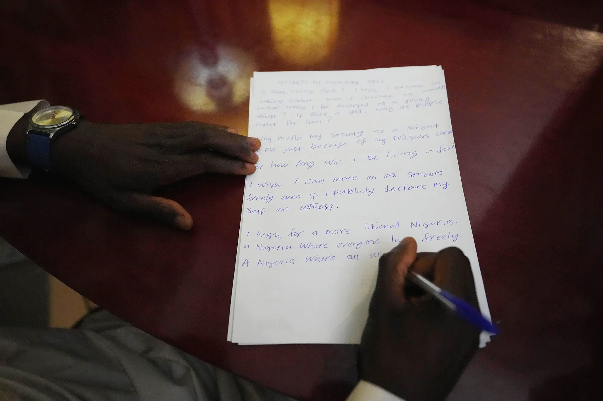 A man writing a hand written letter