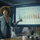 Woman Forecasting In Conference Room