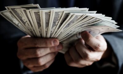Closeup of hands holding cash stock photo