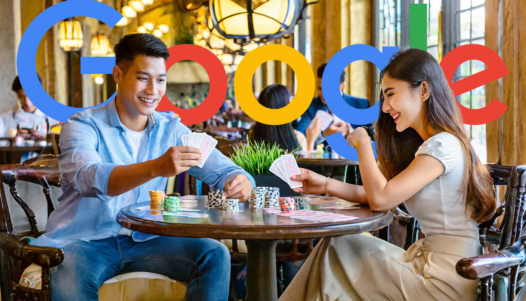 Couple Playing Cards At A Table In A Busy Restaurant Google Logo