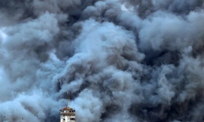 Smoke billows above Gaza City after an Israeli air strike hit the Palestine Tower building on October 7, 2023. — © AFP