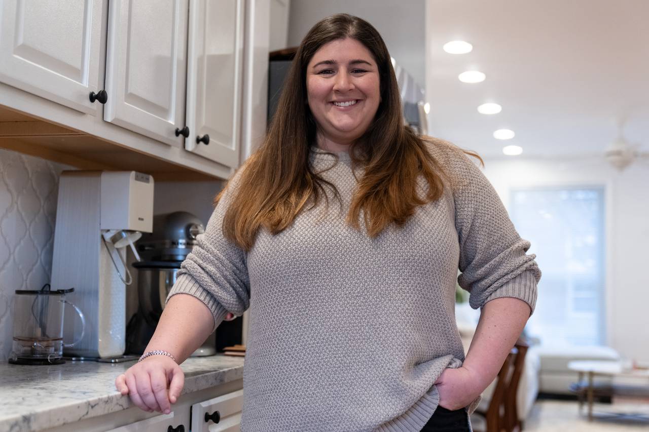 Rachel Lipton smiles for a portrait in her kitchen.