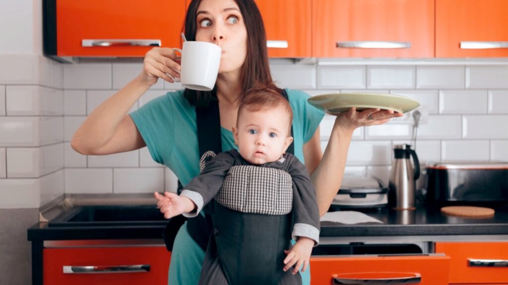 Woman with baby having coffee