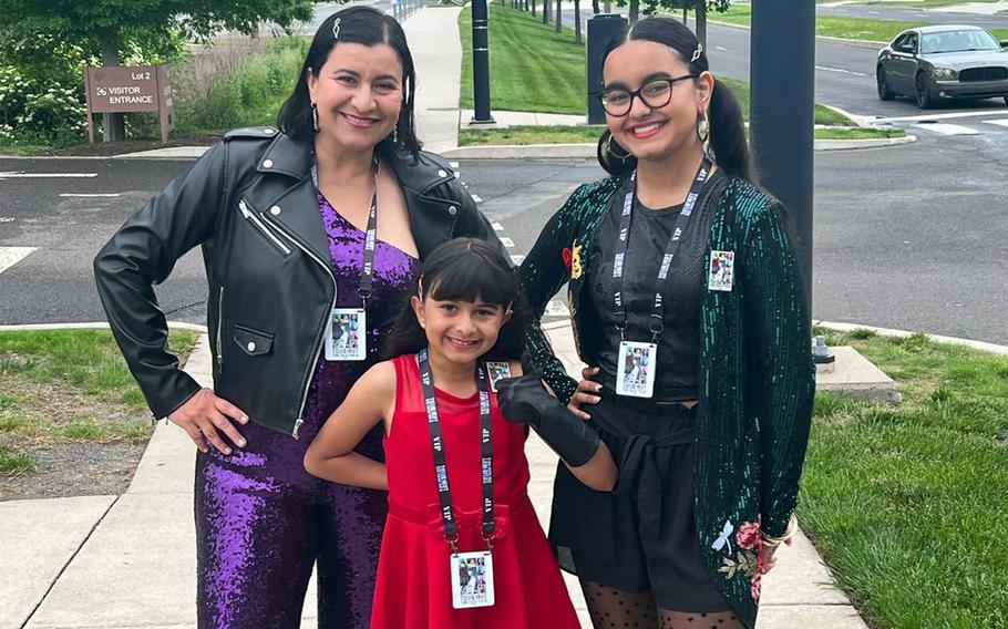 Air Force Col. Iris Ortiz Gonzalez poses with daughters Liana, 9, and Kiara, 17, before a Taylor Swift concert in Philadelphia, May 13, 2023.