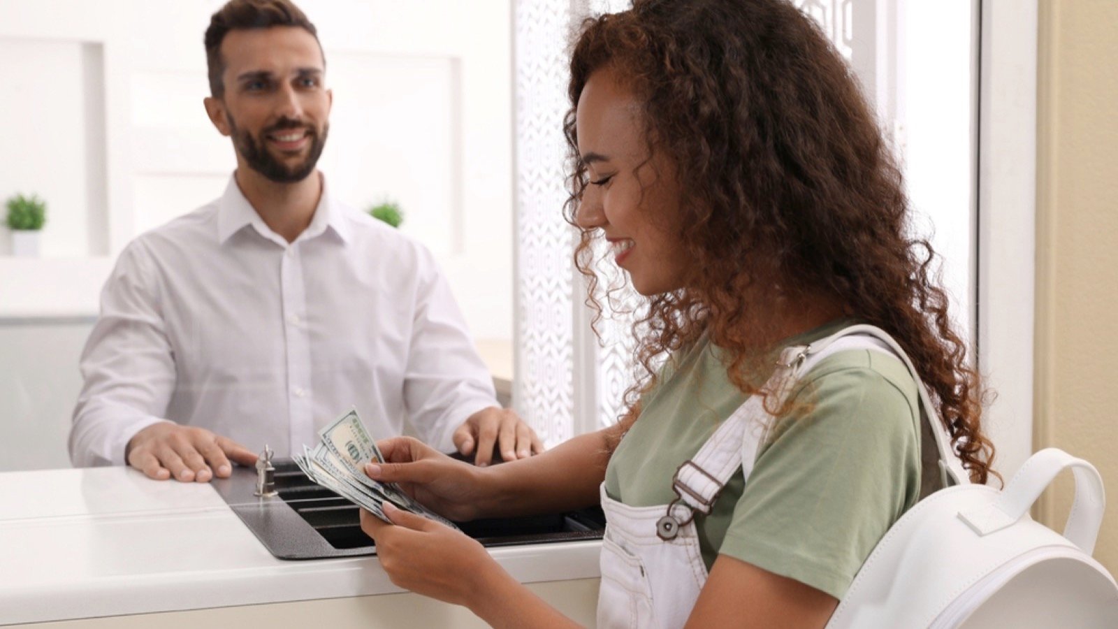 Man depositing money in bank