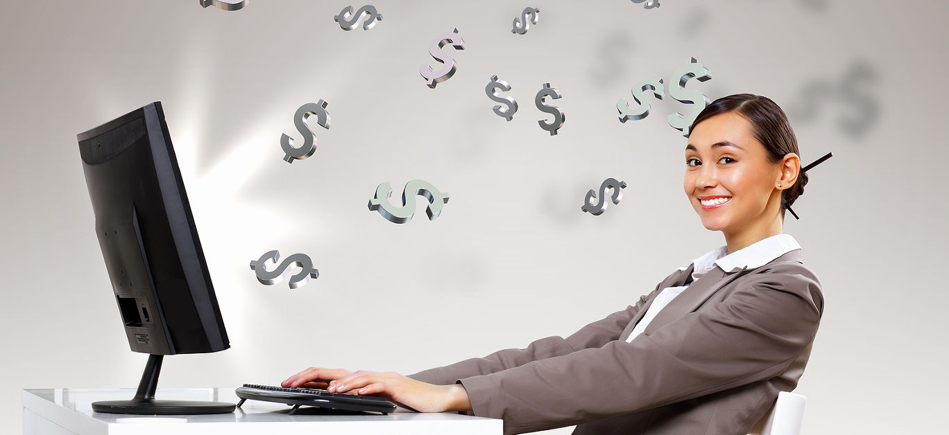 Young businesswoman in the office with money banknotes around her