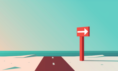 A simple graphical illustration of a road with a directional sign pointing to the right against a blue sky background