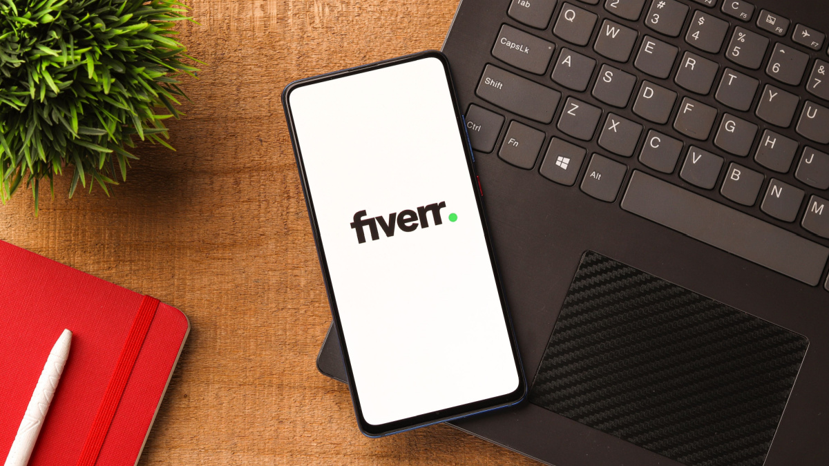 Fiverr logo on phone screen stock image.