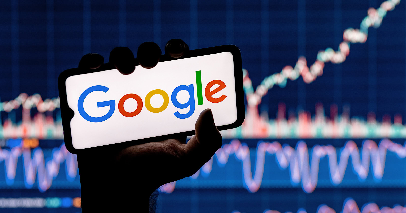 A person holding a smartphone displaying the Google Gemini Era logo, with a blurred background of stock market charts.