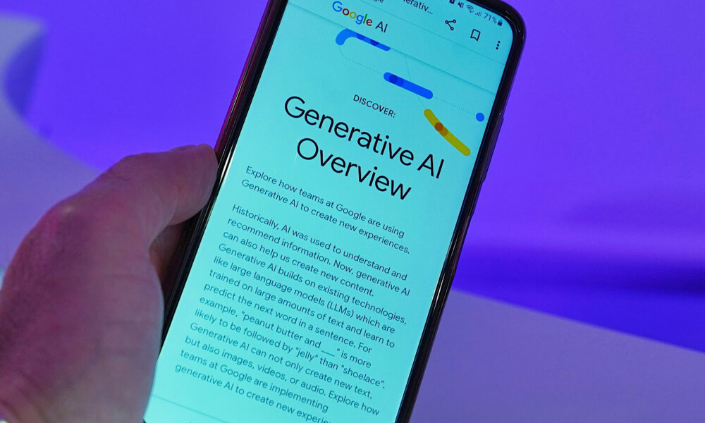 Photo of a mobile device in mans hand with generative google AI Overview on the screen.