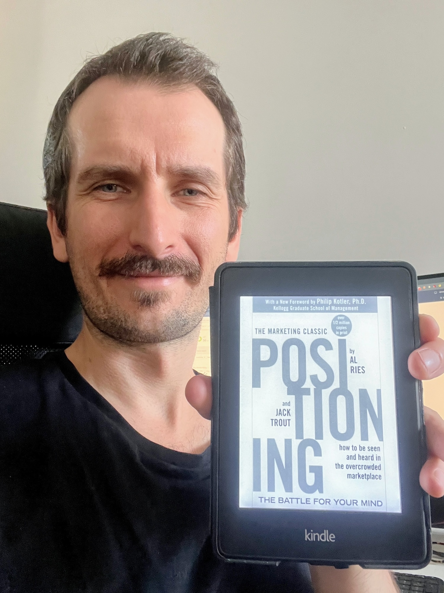 Mateusz holding the book Positioning