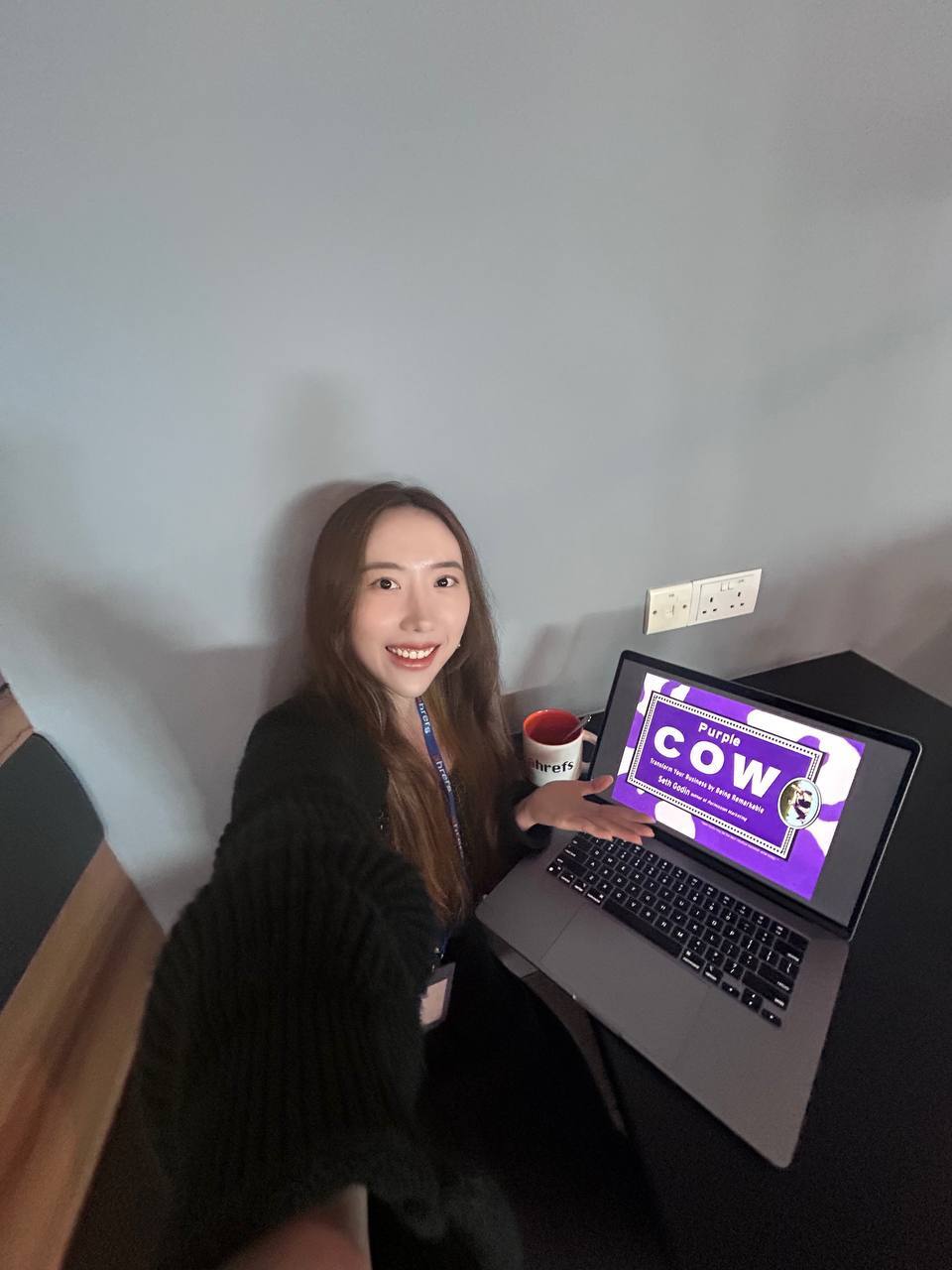 Elysa holding the book Purple Cow