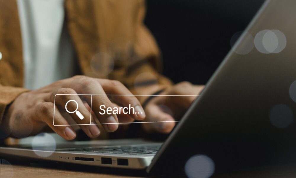 Data Search Technology Search Engine Optimization. man&#039;s hands are using laptop to Searching for information. Marketing ranking traffic website, SEO search engine optimization concept.