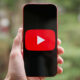 The YouTube logo displayed on a Pixel 10a.