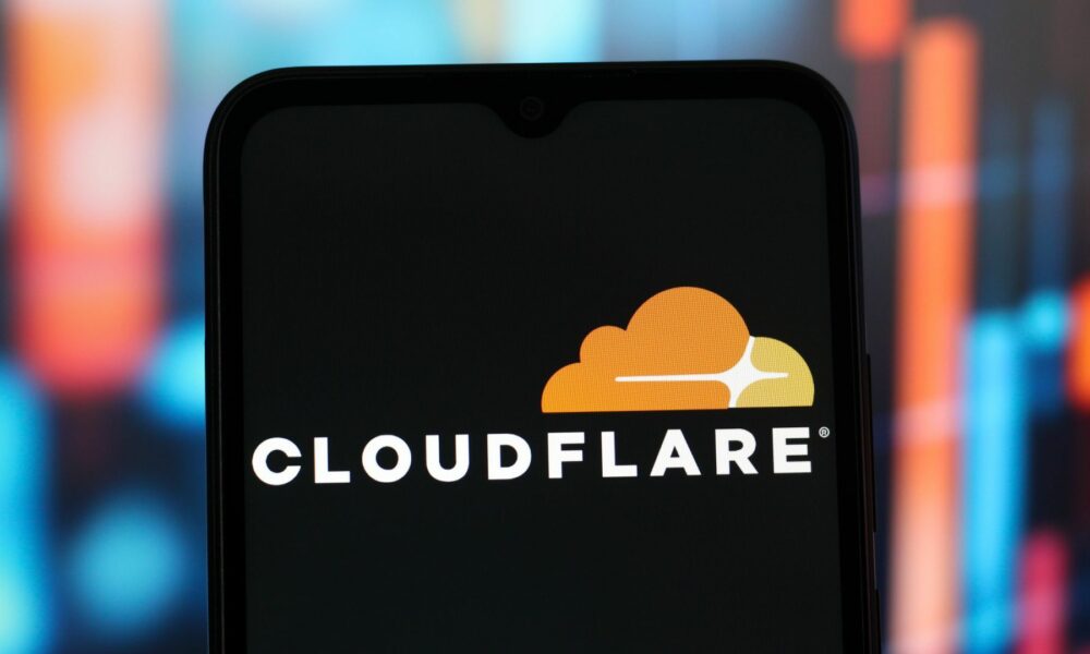 In this photo illustration, the Cloudflare logo is seen displayed on a smartphone screen.