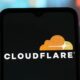 In this photo illustration, the Cloudflare logo is seen displayed on a smartphone screen.